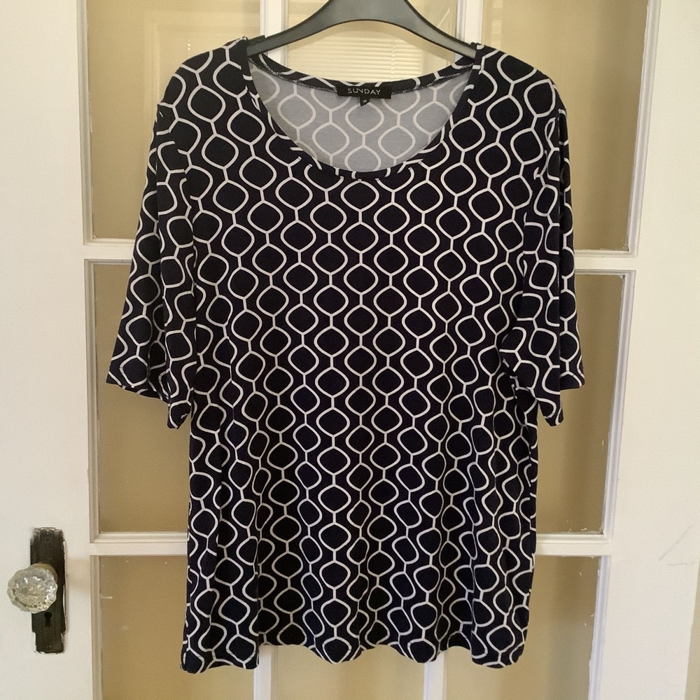 Woman’s top by “Sunday”